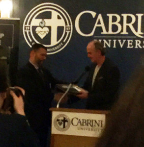 Tom Nerney (r.) founder of the Nerney Leadership Institute at Cabrini University presents Pedro Rivera with the official commendation as Cabrini University's Executive in Residence. 