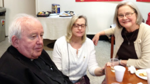 Shrine staff members enjoy socializing with Fr. Smith following his presentation. 