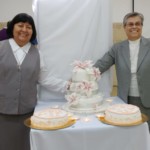 Sr. Marisel and Sr. Lucy cutting cakes